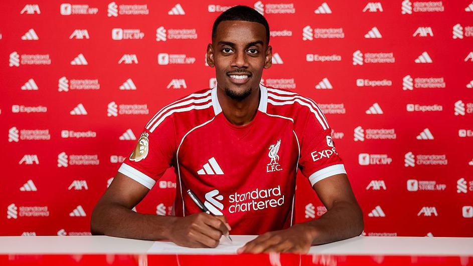 isak at his liverpool signing
